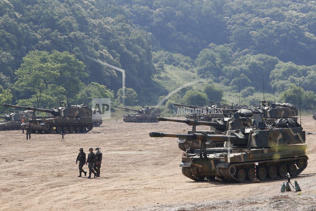 South Korean army K-9 self-propelled howitzers take positions during the annual exercise in Paju, South Korea, near the border with North Korea, Tuesday, June 23, 2020. A South Korean activist said Tuesday hundreds of thousands of leaflets had been launched by balloon across the border with North Korea overnight, after the North repeatedly warned it would retaliate against such actions. (AP Photo/Ahn Young-joon)