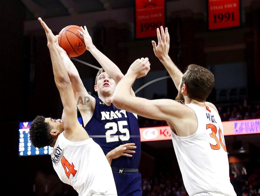 Andrew Shurtleff Navy forward Alec Loehr (25) is pressured by Virginia forwards Justin McKoy (4) and Jay Huff (30) during an NCAA college basketball game in Charlottesville, Va., Sunday, Dec. 29, 2019. (AP Photo/Andrew Shurtleff)