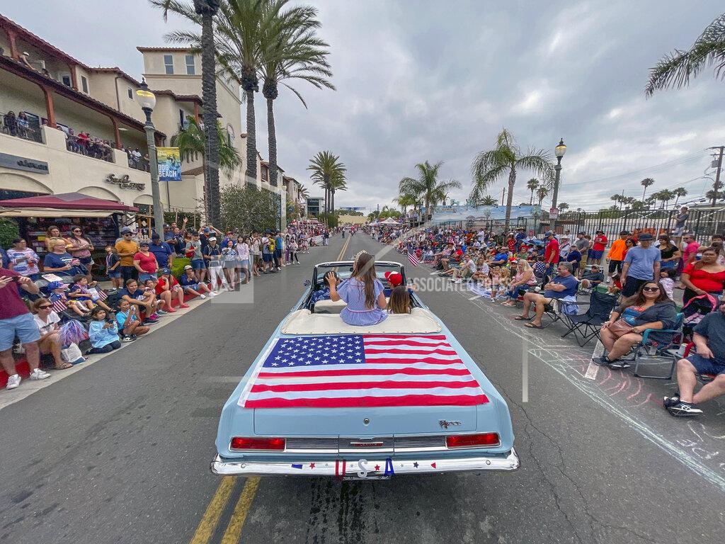 Jeff Gritchen Actress Scarlett Abinante heads up Main Street during the 118th Huntington Beach 4th of July Parade in Huntington Beach, Calif., on Monday, July 4, 2022. (Jeff Gritchen/The Orange County Register via AP)