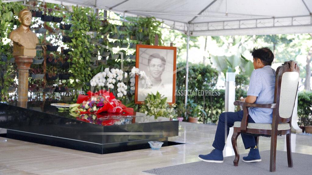 Uncredited In this photo provided by the Office of Ferdinand Marcos Jr., Presidential candidate Ferdinand "Bongbong" Marcos Jr. visits the tomb of his father at the National Heroes Cemetery in Metro Manila, Philippines, on Tuesday May 10, 2022. Marcos, the namesake son of longtime dictator Ferdinand Marcos, apparent landslide victory in the Philippine presidential election is raising immediate concerns about a further erosion of democracy in Asia and could complicate American efforts to blunt growing Chinese influence and power in the Pacific.(Office of Ferdinand Marcos Jr. via AP)