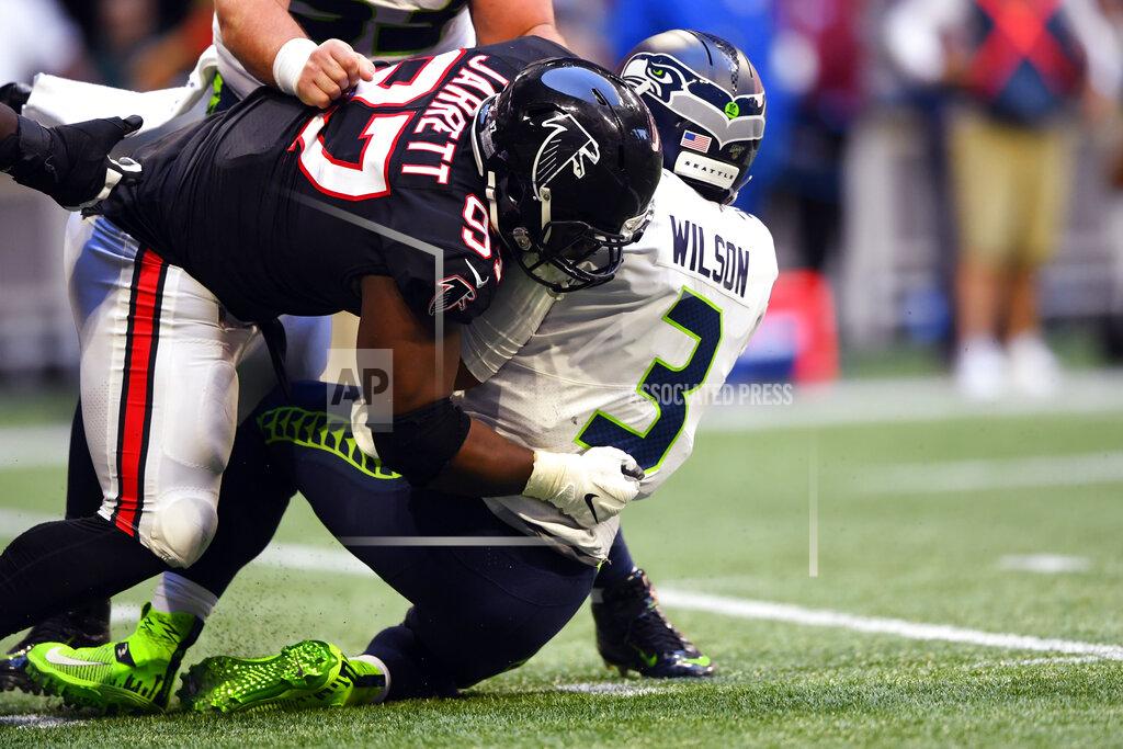 John Amis Atlanta Falcons defensive tackle Grady Jarrett (97) sacks Seattle Seahawks quarterback Russell Wilson (3) during the second half of an NFL football game, Sunday, Oct. 27, 2019, in Atlanta. (AP Photo/John Amis)