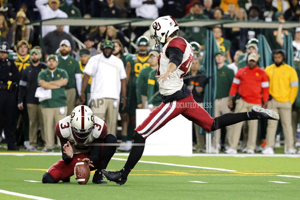 Ray Carlin Oklahoma place kicker Gabe Brkic, right, kicks a 28-yard field goal as Connor McGinnis holds during the second half of an NCAA college football game against Baylor in Waco, Texas, Saturday, Nov. 16, 2019. (AP Photo/Ray Carlin)