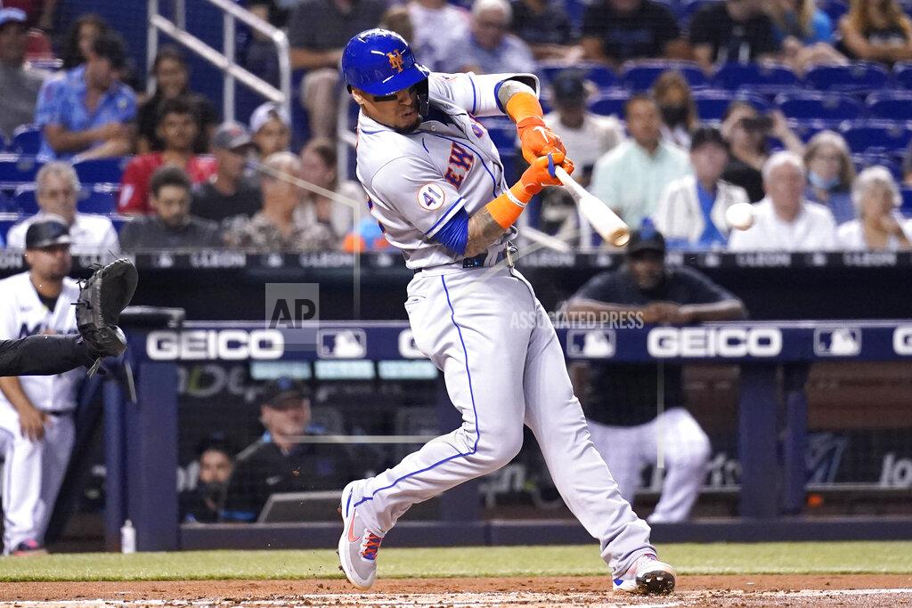 Lynne Sladky New York Mets' Javier Baez hits a single during the second inning of a baseball game against the Miami Marlins, Wednesday, Aug. 4, 2021, in Miami. (AP Photo/Lynne Sladky)