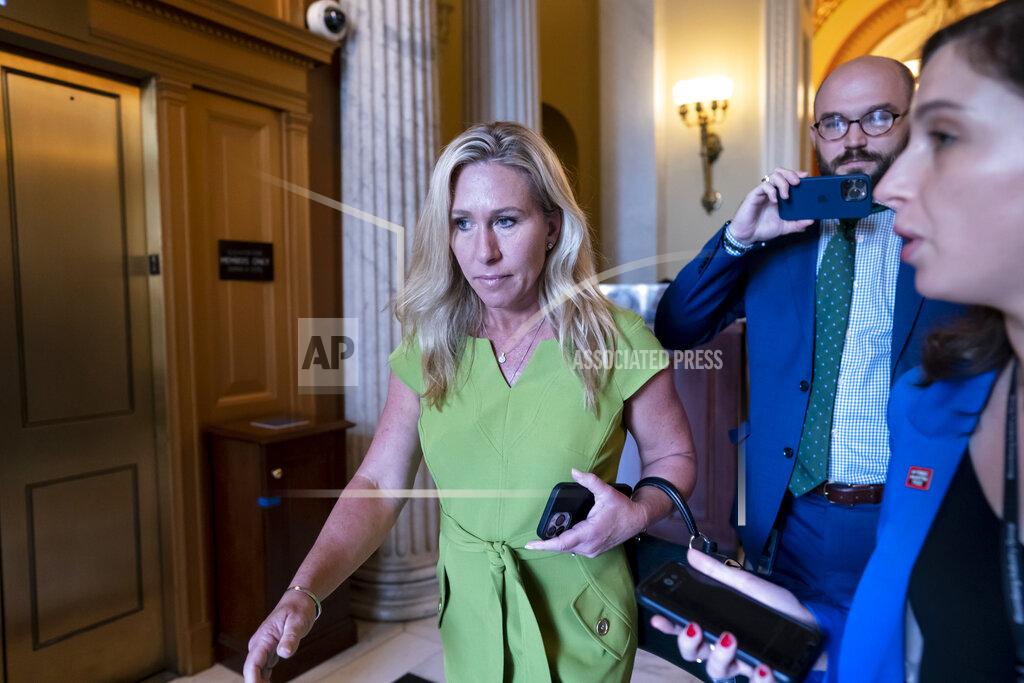 J. Scott Applewhite FILE - Rep. Marjorie Taylor Greene, R-Ga., departs the House chamber at the end of votes, at the Capitol in Washington, May 12, 2022. Greene is testing Republican voters' tolerance for controversy in the May 24, 2022, Republican primary. (AP Photo/J. Scott Applewhite, File)
