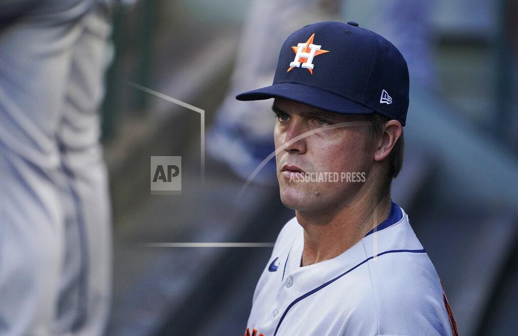 Ted S. Warren Houston Astros starting pitcher Zack Greinke looks out from the dugout before the team's baseball game against the Seattle Mariners, Saturday, April 17, 2021, in Seattle. Greinke threw eight innings of shutout ball, giving up four hits, before Ryan Pressly closed out the game in the ninth. The Astros won 1-0. (AP Photo/Ted S. Warren)
