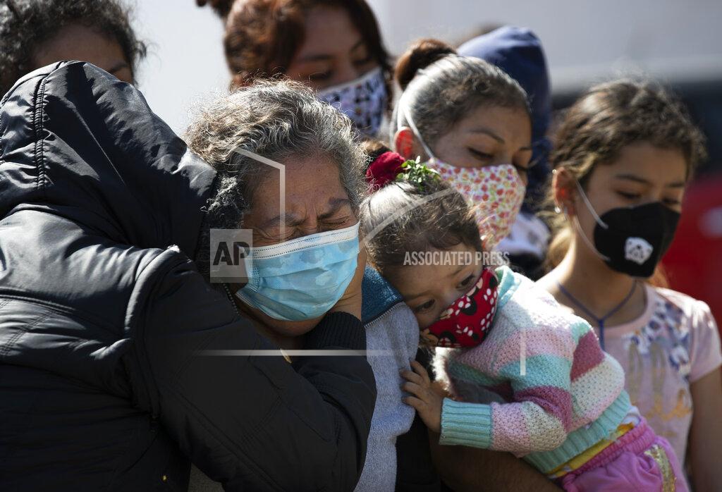 Relatives bury Isaac Nolasco who died of reasons not believed related to COVID-19, in a section of the municipal cemetery Valle de Chalco amid the new coronavirus pandemic, on the outskirts of Mexico City, Sunday, Oct. 25, 2020. Mexican families traditionally flock to local cemeteries to honor their dead relatives as part of the "Dia de los Muertos," or Day of the Dead celebrations, but according to authorities, the cemeteries will be closed this year to help curb the spread of COVID-19. (AP Photo/Marco Ugarte)
