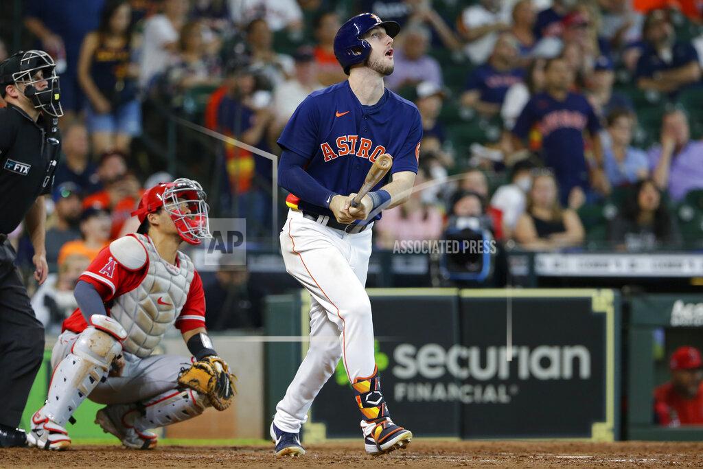 Michael Wyke Houston Astros' Kyle Tucker, right, watches his two-run home run in front of Los Angeles Angels catcher Kurt Suzuki, second from left, during the sixth inning of a baseball game Sunday, Sept. 12, 2021, in Houston. (AP Photo/Michael Wyke)
