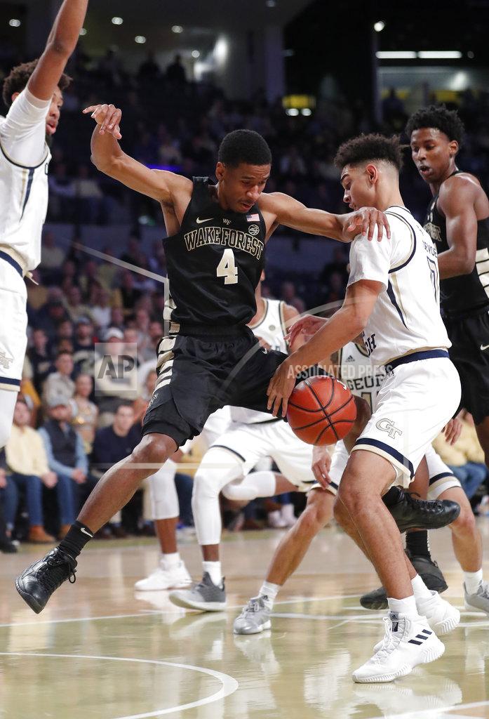 John Bazemore Wake Forest guard Torry Johnson (4) can't hang on to the ball as he drives against Georgia Tech guard Michael Devoe (0) during the first half of an NCAA college basketball game, Saturday, Jan. 5, 2019, in Atlanta. (AP Photo/John Bazemore)