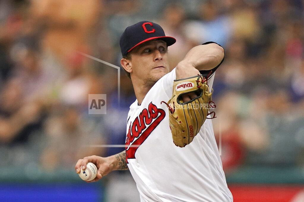 Tony Dejak Cleveland Indians starting pitcher Zach Plesac delivers in the first inning of the team's baseball game against the Tampa Bay Rays, Friday, July 23, 2021, in Cleveland. (AP Photo/Tony Dejak)