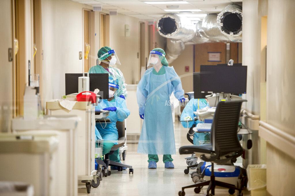 Michael Holahan Medical personnel work inside the COVID-19 unit at University Hospital in Augusta, Ga., Wednesday, Dec. 16, 2020. COVID-19 cases nationwide have been increasing in recent weeks. (Michael Holahan/The Augusta Chronicle via AP)