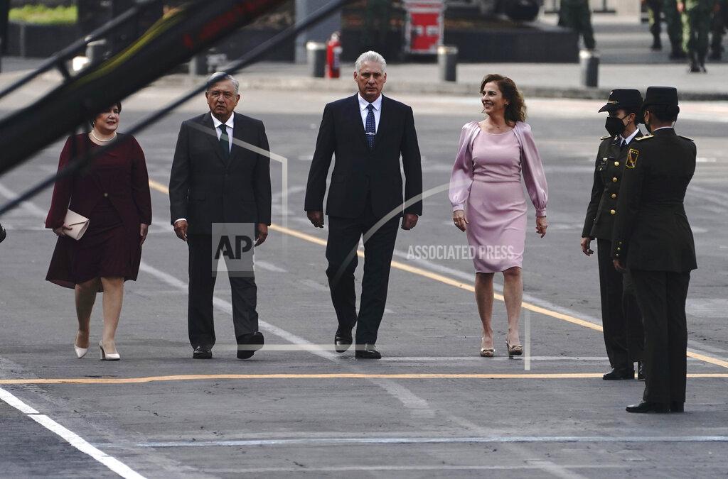Marco Ugarte Cuba's first lady Lis Cuesta, from left, Mexico's President Andres Manuel Lopez Obrador, Cuba's President Miguel Diaz-Canel and Mexico's first lady Beatriz Gutierrez Muller, take part in Mexico's Independence Day celebrations, in the Zocalo in Mexico City, Thursday, Sept. 16, 2021. (AP Photo/Marco Ugarte)