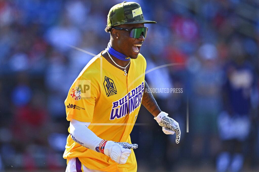 David Dermer Las Vegas Raiders wide receiver Henry Ruggs III celebrates after hitting a home run during the Jarvis Landry Celebrity Softball game Saturday, June 12, 2021, in Eastlake, Ohio. (AP Photo/David Dermer)