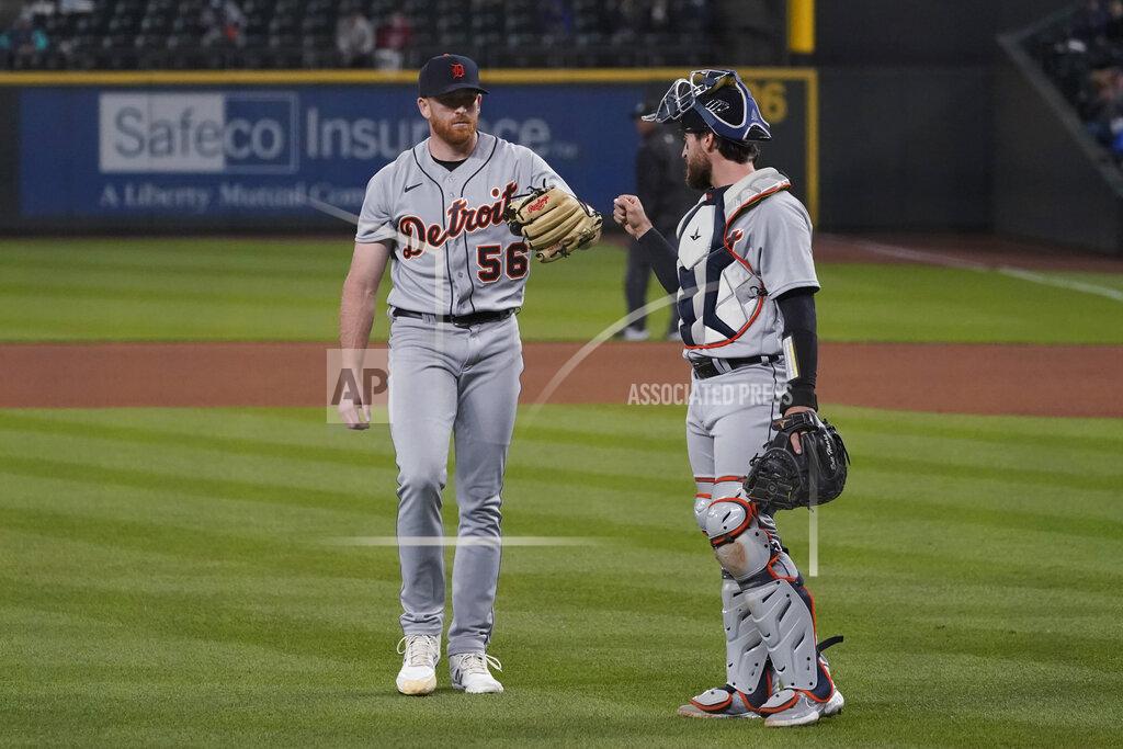 Ted S. Warren Detroit Tigers starting pitcher Spencer Turnbull, left walks with catcher Eric Haase at the end of the seventh inning of the team's baseball game against the Seattle Mariners, Tuesday, May 18, 2021, in Seattle. (AP Photo/Ted S. Warren)