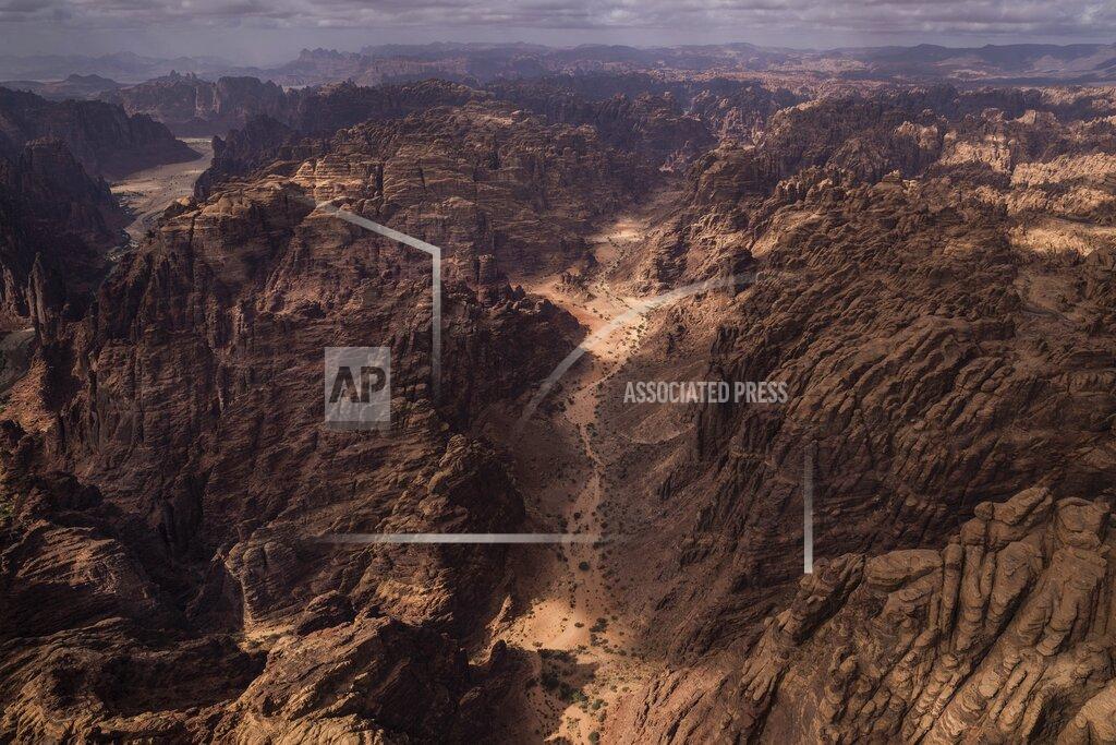 Bernat Armangue This Wednesday, Jan. 8, 2020 photo shows an overview of stage four of the Dakar Rally between Neom and Al Ula, in Saudi Arabia. Formerly known as the Paris-Dakar Rally, the race was created by Thierry Sabine after he got lost in the Libyan desert in 1977. Until 2008, the rallies raced across Africa, but threats in Mauritania led organizers to cancel that year's event and move it to South America. It has now shifted to Saudi Arabia. The race started on Jan. 5 with 560 drivers and co-drivers, some on motorbikes, others in cars or in trucks. Only 41 are taking part in the Original category. (AP Photo/Bernat Armangue)