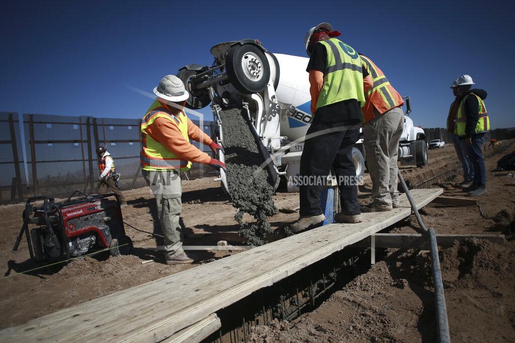 Christian Chavez FILE - In this Jan. 12, 2021, file photo, workers prepare the foundation for a steel section of border wall that will be built on the Mexican side of older metal fencing dividing Ciudad Juarez, Mexico from Sunland Park, New Mexico, on the outskirts of Ciudad Juarez, Mexico. Immigrant rights activists energized by a new Democratic administration and majorities on Capitol Hill are gearing up for a fresh political battle. A coalition of national advocacy groups on Monday announced a multimillion-dollar campaign to help push through President Joe Biden’s plan to open a citizenship pathway for up to 11 million people. (AP Photo/Christian Chavez, File)