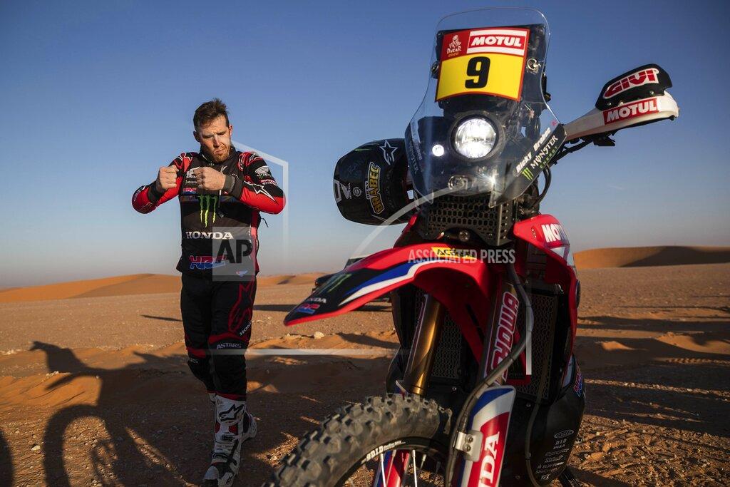 Bernat Armangue Ricky Brabec of United States rides his Honda motorbike warms up before the start of stage twelve of the Dakar Rally between Haradth and Qiddiya, Saudi Arabia, Friday, Jan. 17, 2020. (AP Photo/Bernat Armangue)