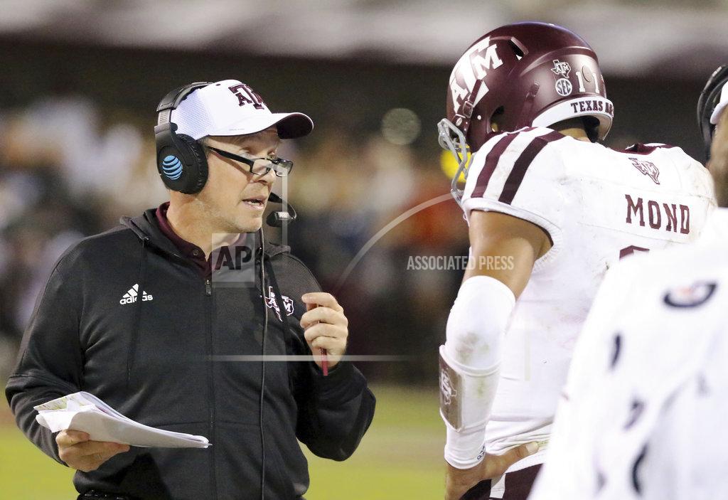 Jim Lytle Texas A&M head coach Jimbo Fisher, left, talks to quarterback Kellen Mond (11) during the second half of an NCAA college football game against Mississippi State, Saturday, Oct. 27, 2018, in Starkville, Miss. (AP Photo/Jim Lytle)