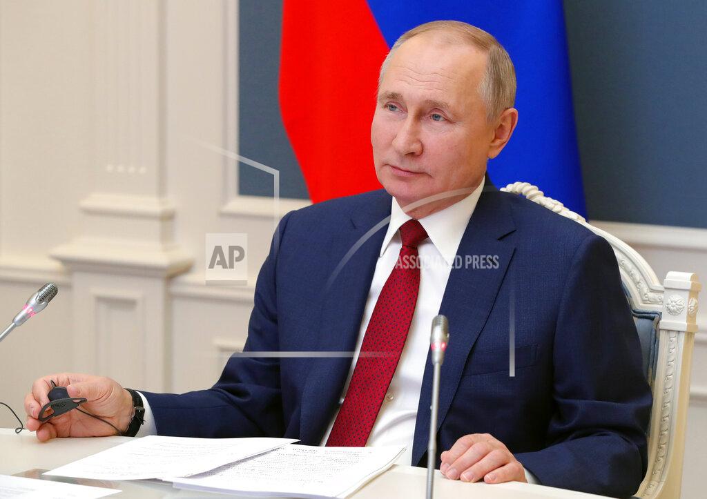 Mikhail Klimentyev Russian President Vladimir Putin speaks to participants of the the World Economic Forum via a video link in Moscow, Russia, Wednesday, Jan. 27, 2021. Putin warned of rising global tensions and growing risks of new conflicts and called for broader international cooperation to tackle new challenges. (Mikhail Klimentyev, Sputnik, Kremlin Pool Photo via AP)