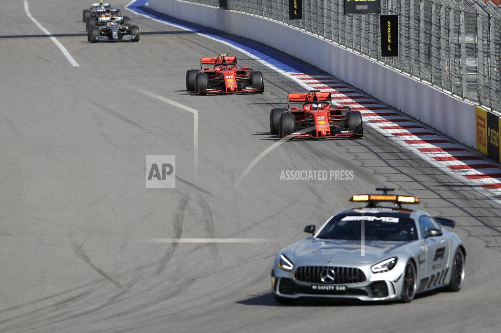 Luca Bruno Safety Car drives ahead of Ferrari driver Sebastian Vettel of Germany, and Ferrari driver Charles Leclerc of Monaco during the Russian Formula one Grand Prix, at the 'Sochi Autodrom' Formula One circuit, in Sochi, Russia, Sunday, Sept. 29, 2019. (AP Photo/Luca Bruno)