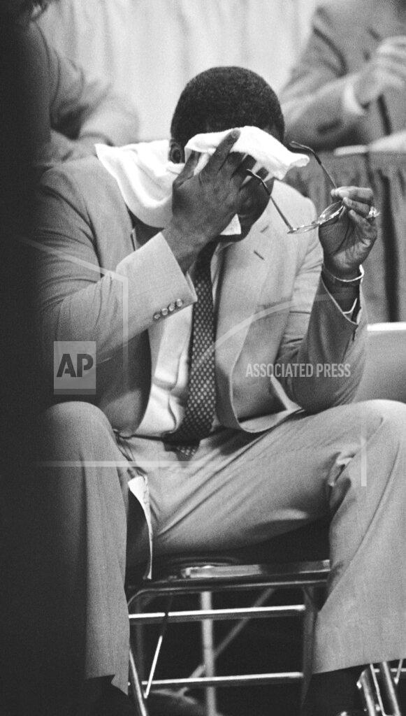 John Swart FILE - In this April 1, 1985, file photo, Georgetown coach John Thompson wipes his brow during the closing minutes of the college basketball NCAA Final Four championship game against Villanova, in Lexington, Ky. Underdog Villanova, shooting 79 percent from the field, denied Patrick Ewing and top-ranked Georgetown a second straight NCAA basketball title with a 66-64 victory. (AP Photo/John Swart, File)