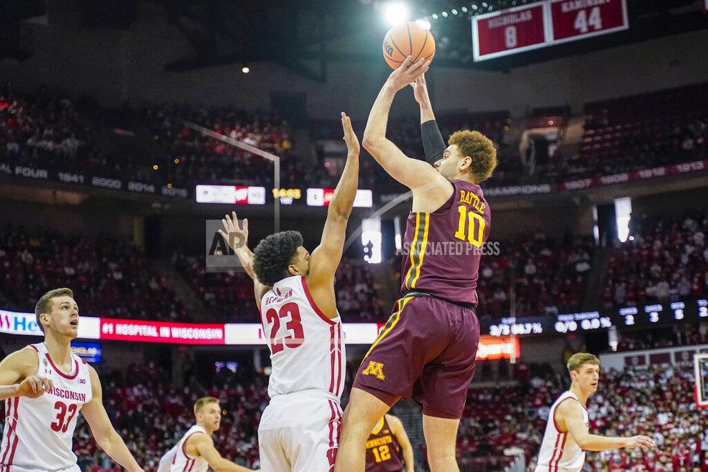 Andy Manis Minnesota's Jamison Battle (10) shoots against Wisconsin's Chucky Hepburn (23) during the first half of an NCAA college basketball game Sunday, Jan. 30, 2022, in Madison, Wis. (AP Photo/Andy Manis)