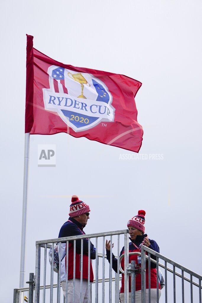 Jeff Roberson Fans wear hats as the wind blows during a practice day at the Ryder Cup at the Whistling Straits Golf Course Thursday, Sept. 23, 2021, in Sheboygan, Wis. (AP Photo/Jeff Roberson)