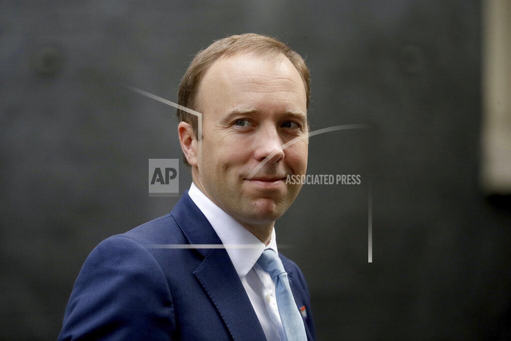 Matt Dunham FILE - In this Wednesday, Sept. 16, 2020 file photo, British Health Secretary Matt Hancock walks from 10 Downing Street in London. Britain’s health minister has apologized for breaching social distancing rules after a newspaper ran pictures of him embracing a woman with whom he allegedly had an affair. Health Secretary Matt Hancock said in a statement that “I accept that I breached the social distancing guidance in these circumstances." He said “I have let people down and am very sorry.” The tabloid Sun newspaper reported Friday, June 25, 2021 that Hancock had an extramarital affair with a senior aide, Gina Coladangelo. (AP Photo/Matt Dunham, File)