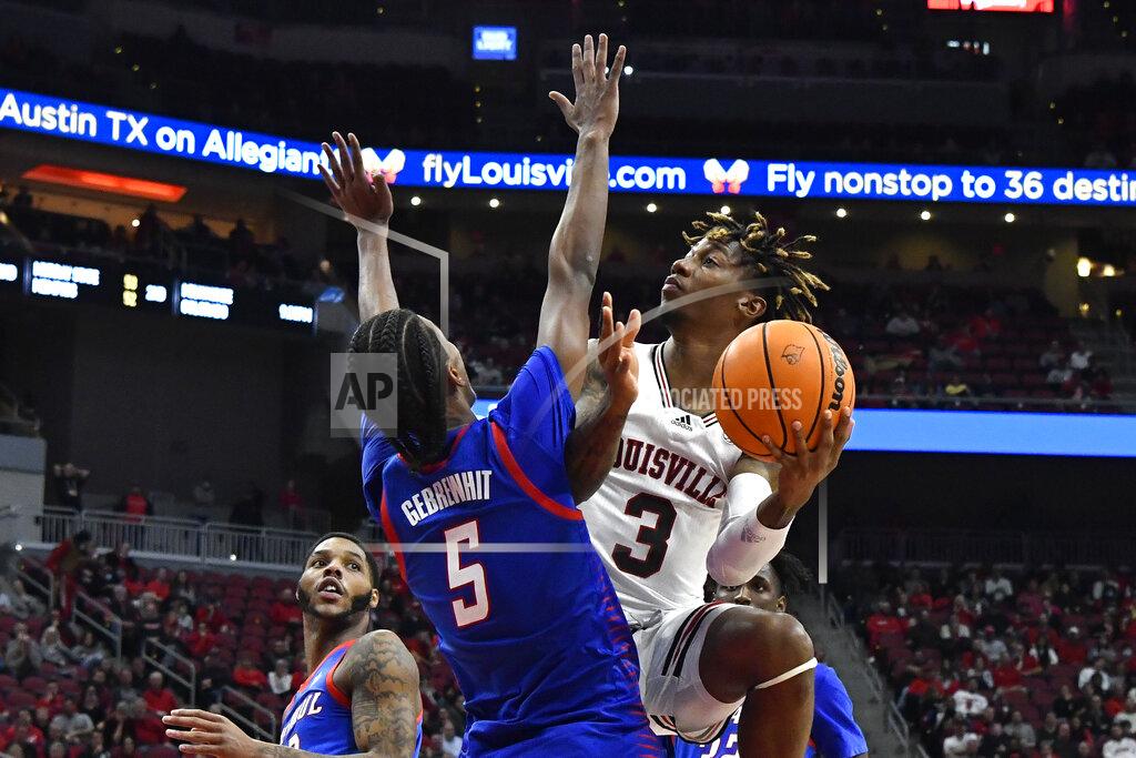 Timothy D. Easley Louisville guard El Ellis (3) looks to the basket as DePaul guard Philmon Gebrewhit (5) defends during the second half of an NCAA college basketball game in Louisville, Ky., Friday, Dec. 10, 2021. (AP Photo/Timothy D. Easley)