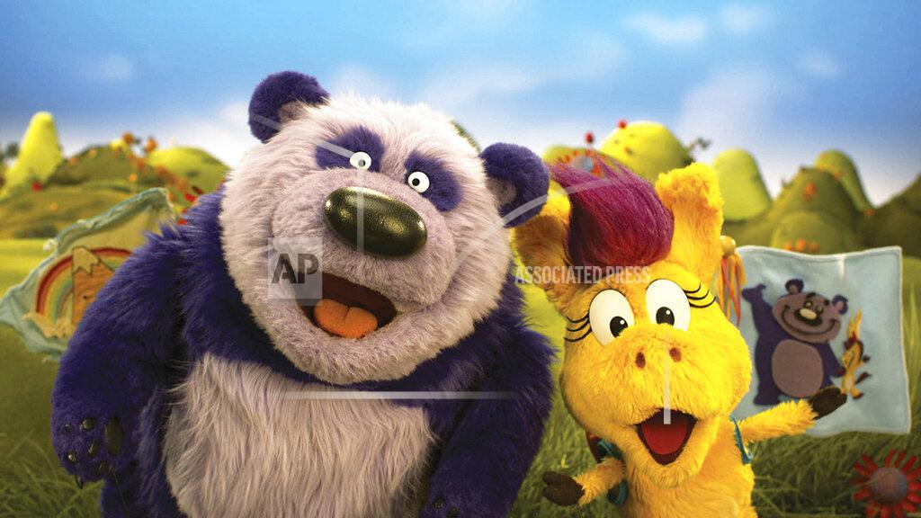 Uncredited This image released by PBS Kids shows puppet characters Purple Panda, left, and Donkey Hodie from the new series, “Donkey Hodie,” inspired from characters in the original Fred Rogers TV show. The whimsical series for children ages 3-5 starts airing Monday and centers on the adventures of Donkey Hodie, an enthusiastic yellow donkey with a bright magenta mane. (Fred Rogers Productions/PBS Kids via AP)