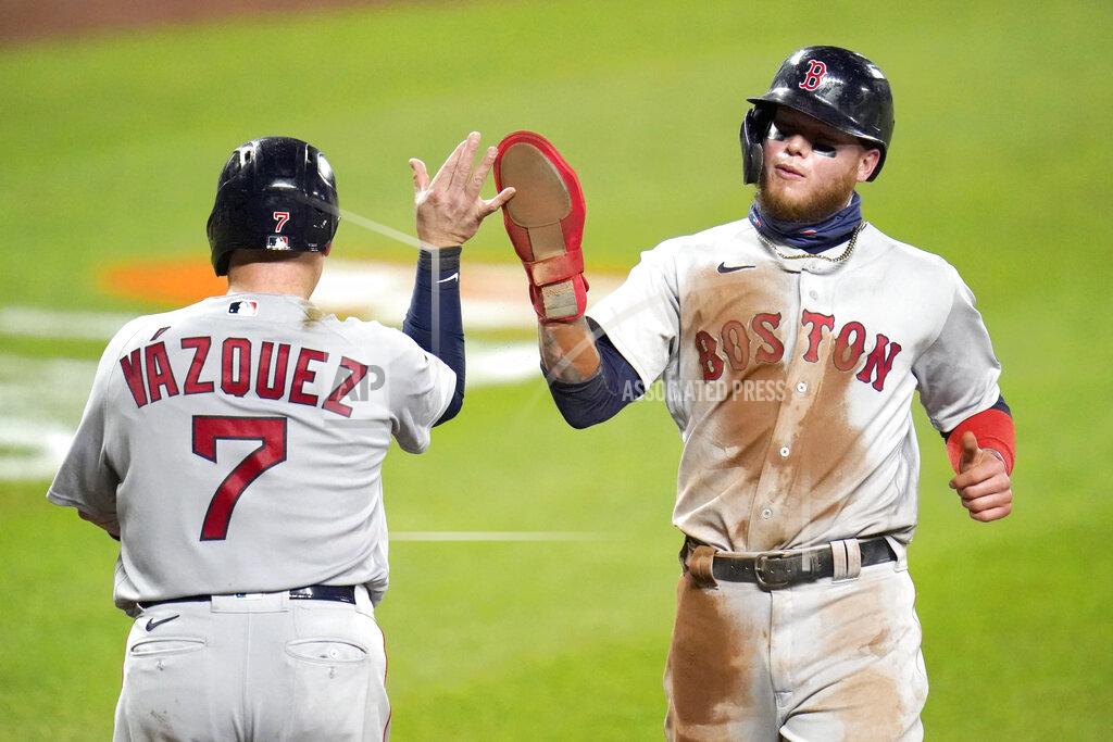 Julio Cortez Boston Red Sox's Christian Vazquez (7) and Alex Verdugo react after scoring on a single by Michael Chavis during the sixth inning of a baseball game against the Baltimore Orioles, Friday, Aug. 21, 2020, in Baltimore. (AP Photo/Julio Cortez)