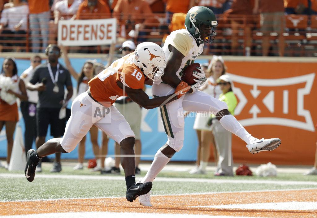 Eric Gay Baylor wide receiver Denzel Mims (15) makes a 19-yard catch in front of Texas defensive back Davante Davis (18) for a touchdown during the first half of an NCAA college football game, Saturday, Oct. 13, 2018, in Austin, Texas. (AP Photo/Eric Gay)