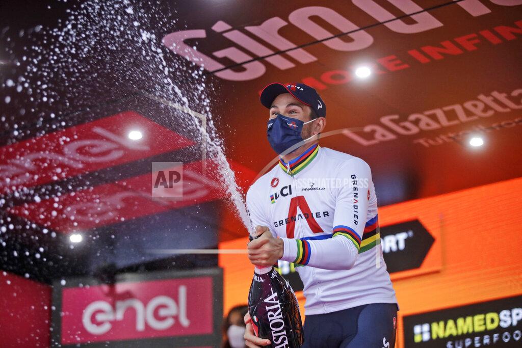 Luca Bruno Italy's Filippo Ganna celebrates on the podium after winning the final stage of the Giro d'Italia cycling race, a 15.7 kilometers (9.756 miles) individual time trial from Cernusco sul Naviglio to Milan, Italy, Sunday, Oct. 25, 2020. (AP Photo/Luca Bruno)