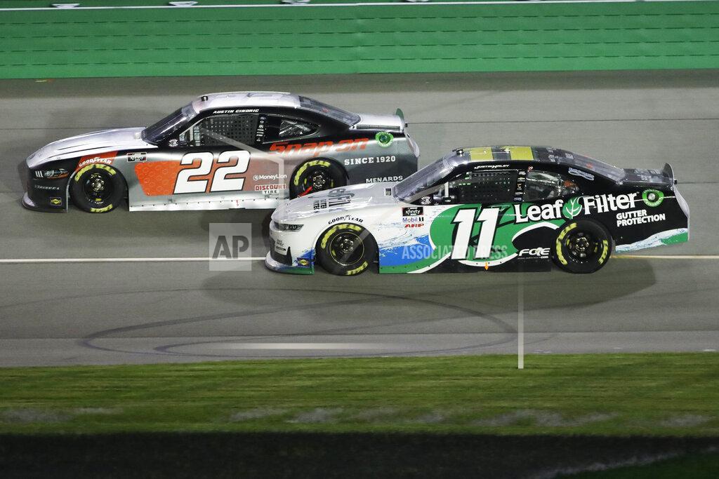 Mark Humphrey Austin Cindric (22) and Justin Haley (11) work on the track during a NASCAR Xfinity Series auto race Thursday, July 9, 2020, in Sparta, Ky. (AP Photo/Mark Humphrey)