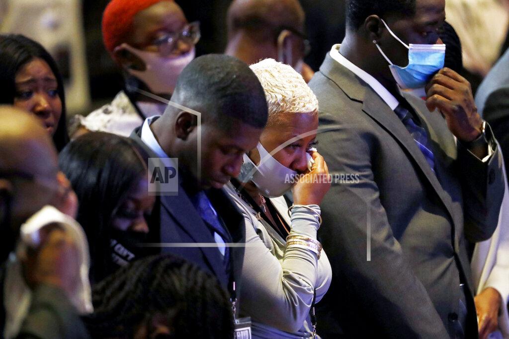 Julio Cortez Shareeduh Tate, second from left, reacts during an 8:46 pause during a memorial service for George Floyd at North Central University Thursday, June 4, 2020, in Minneapolis. (AP Photo/Julio Cortez)