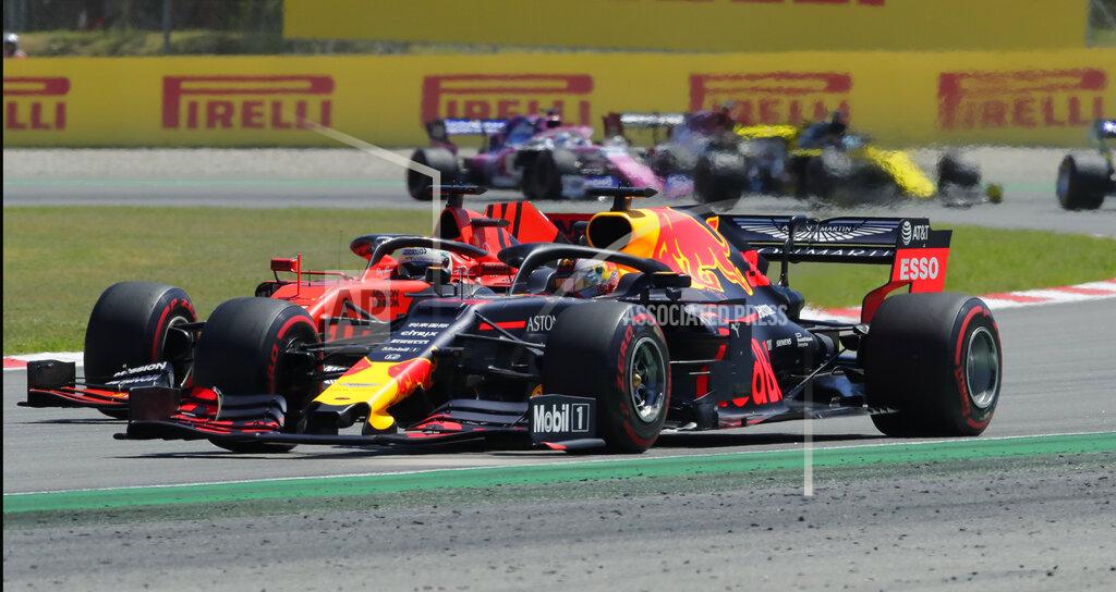 Manu Fernandez Red Bull driver Max Verstappen of the Netherland's overtakes Ferrari driver Sebastian Vettel of Germany during the Spanish Formula One race at the Barcelona Catalunya racetrack in Montmelo, just outside Barcelona, Spain, Sunday, May 12, 2019. (AP Photo/Manu Fernandez)