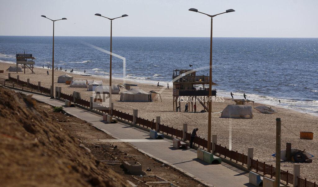 Hatem Moussa A beach is almost empty during a lockdown after a 48 hour lockdown was imposed following the discovery of the first local coronavirus cases in the Gaza Strip, Wednesday, Aug. 26, 2020. (AP Photo/Hatem Moussa)