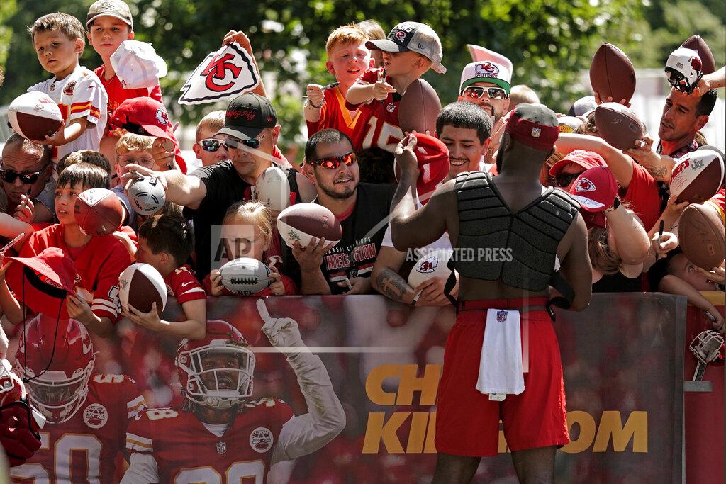 Charlie Riedel Kansas City Chiefs running back Clyde Edwards-Helaire signs autographs at NFL football training camp Saturday, July 30, 2022, in St. Joseph, Mo. (AP Photo/Charlie Riedel)