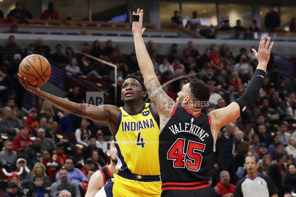 Nam Y. Huh Indiana Pacers guard Victor Oladipo, left, drives to the basket as Chicago Bulls guard Denzel Valentine defends during the first half of an NBA basketball game in Chicago, Friday, March 6, 2020. (AP Photo/Nam Y. Huh)