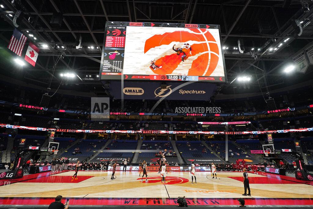 Chris O'meara The Toronto Raptors and the Miami Heat tip off to start during the first half of an NBA preseason basketball game Friday, Dec. 18, 2020, in Tampa, Fla. The Raptors are playing their home games in Tampa as a result of Canada's strict travel regulations stemming from the coronavirus pandemic. (AP Photo/Chris O'Meara)