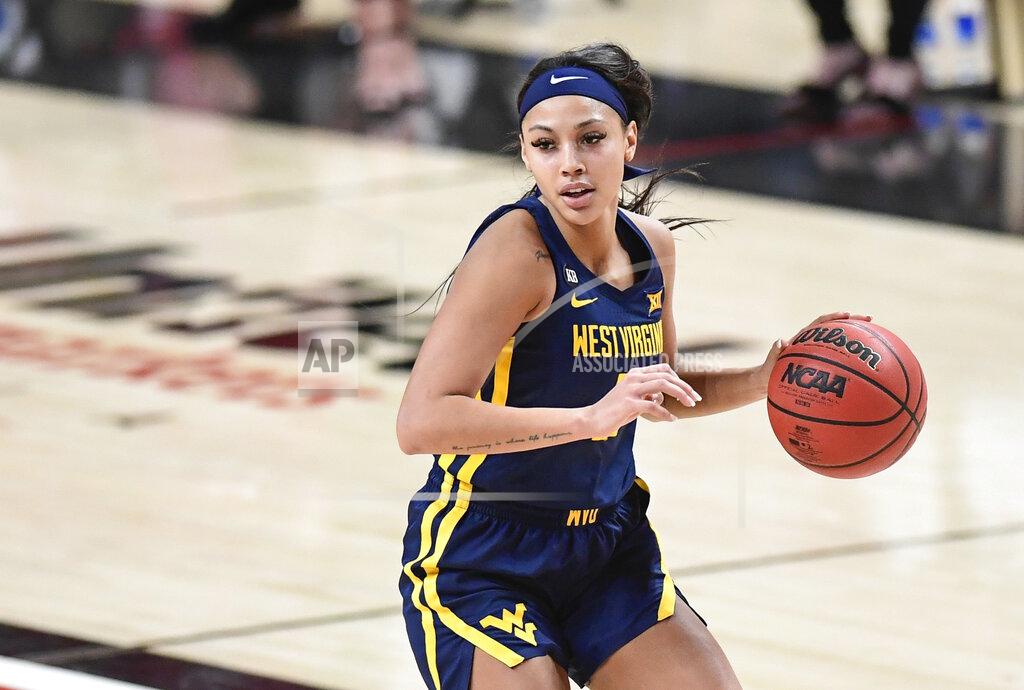 Justin Rex FILE - In this Jan. 27, 2021, file photo, West Virginia's Kysre Gondrezick (2) controls the ball during the second half of the team's NCAA college basketball game against Texas Tech in Lubbock, Texas. Indiana selected Gondrezick in the WNBA draft Thursday, April 15. (Justin Rex/Lubbock Avalanche-Journal via AP, File)