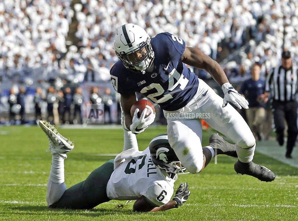 Chris Knight Penn State's Miles Sanders (24) is tripped by Michigan State's David Dowell (6) after a long run during the first half of an NCAA college football game in State College, Pa., Saturday, Oct. 13, 2018. (AP Photo/Chris Knight)