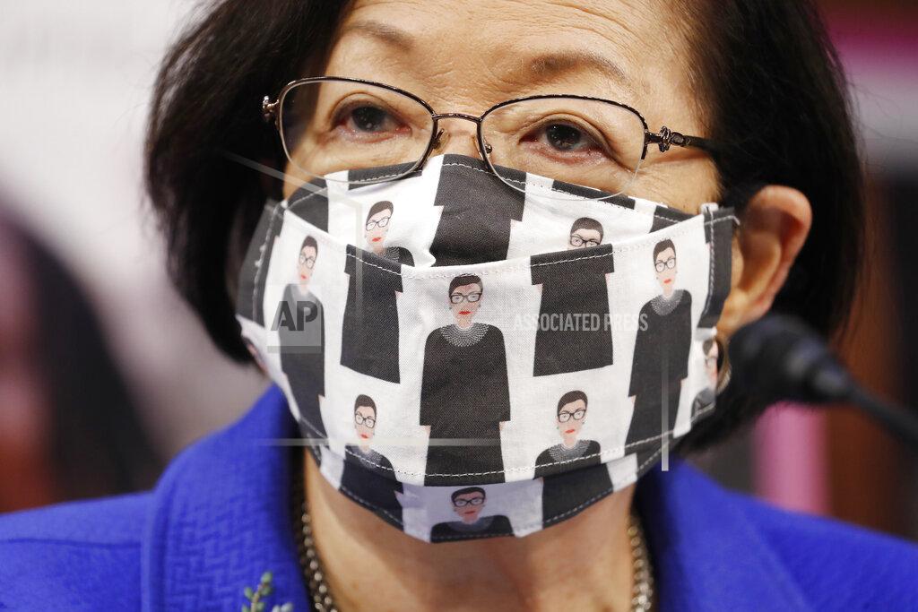Shawn Thew Sen. Mazie Hirono, D-Hawaii, wears a mask showing former Supreme Court Justice Ruth Bader Ginsburg during a confirmation hearing for Supreme Court nominee Amy Coney Barrett before the Senate Judiciary Committee, Monday, Oct. 12, 2020, on Capitol Hill in Washington. (Shawn Thew/Pool via AP)
