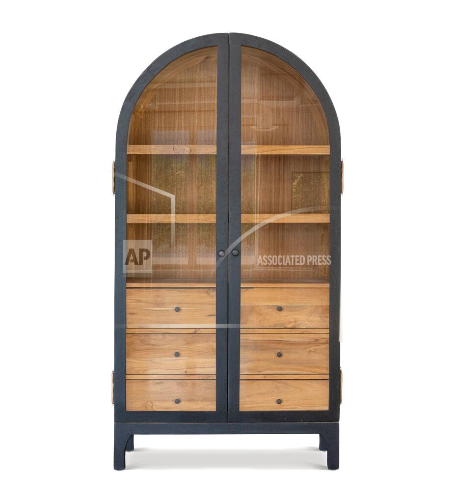 Uncredited This image released by designer Lindye Galloway shows the Bixby hutch, featuring the rounded silhouette of Big Sur’s Bixby Canyon Bridge arch, in natural teak trimmed in black. (Lindye Galloway via AP)