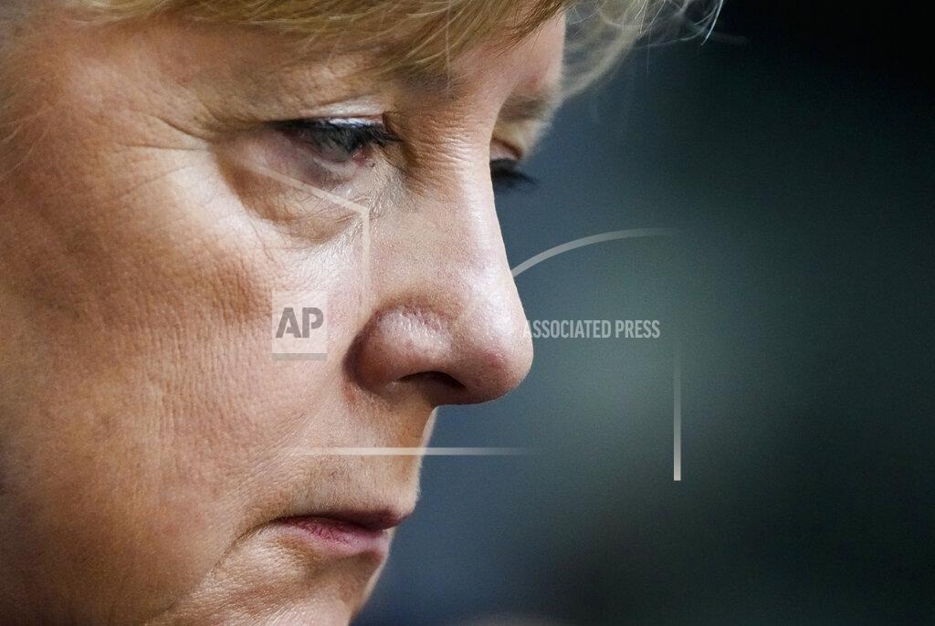 Markus Schreiber Chancellor Abgela Merkel sits on the visitors tribune as she attends the constituent session of German parliament at the Reichstag building in Berlin, Tuesday, Oct. 26, 2021. Following the national elections on September 26th, the parliament Bundestag meet for the constituent parliamentary session. (AP Photo/Markus Schreiber)