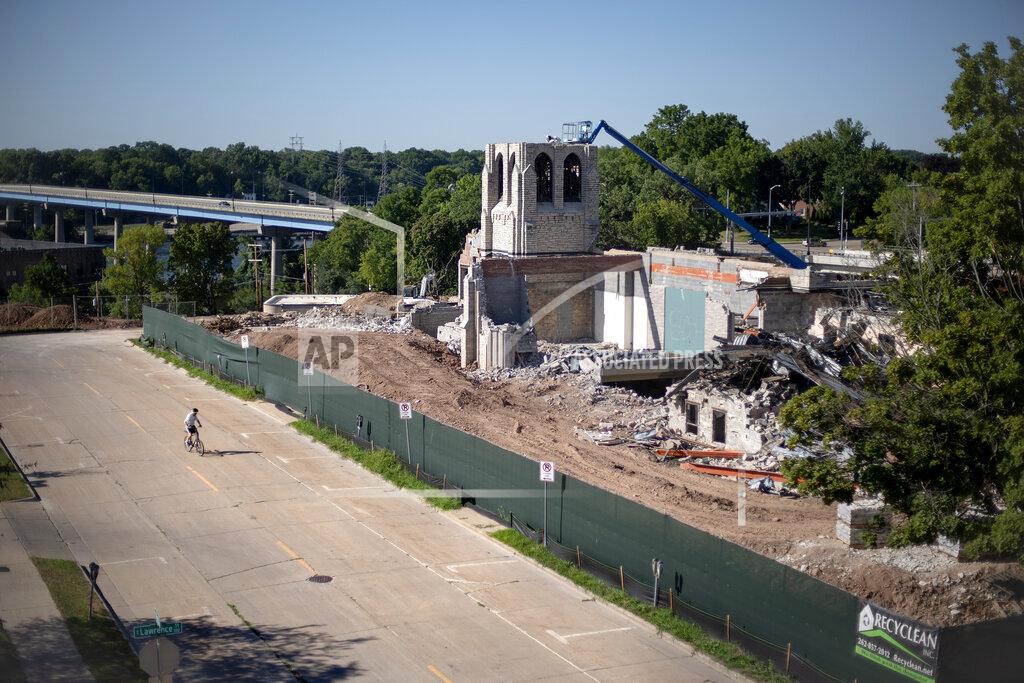 David Goldman A church is demolished where the oil services firm U.S. Ventures announced it would build a new headquarters employing 500 people on a city bluff in Appleton, Wis., Aug. 19, 2020. Then the coronavirus pandemic struck. The status of the U.S. Ventures headquarters is now uncertain, but even as the old church on the bluff gets demolished for a groundbreaking the headquarters certainly won't open as announced in 2022. (AP Photo/David Goldman)