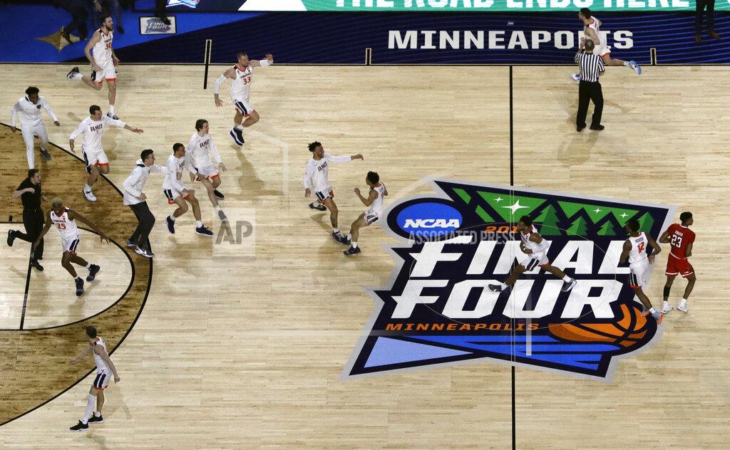 Morry Gash Virginia players celebrate after defeating Texas Tech 85-77 in the overtime in the championship of the Final Four NCAA college basketball tournament, Monday, April 8, 2019, in Minneapolis. (AP Photo/Morry Gash)