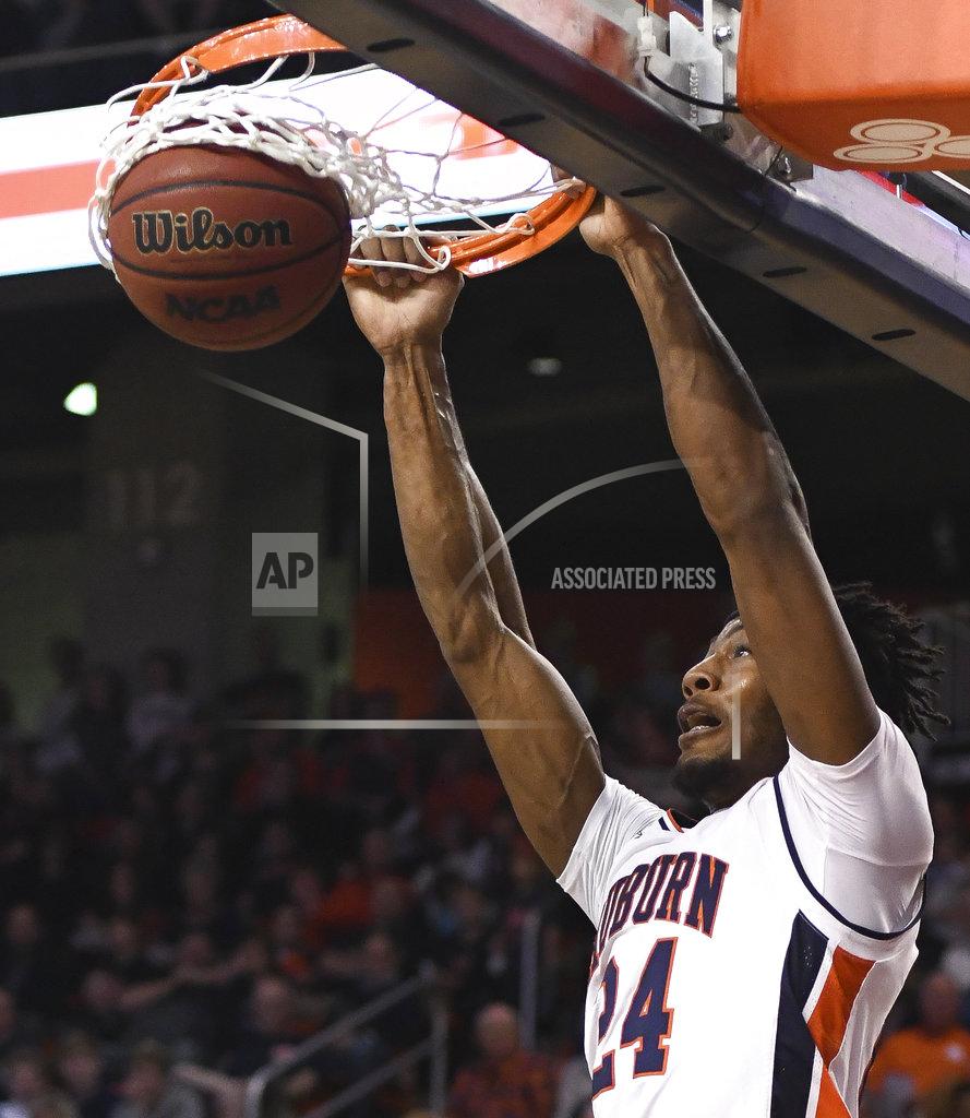 Julie Bennett Auburn forward Anfernee McLemore (24) dunks against North Florida during the first half of an NCAA college basketball game Saturday, Dec. 29, 2018, in Auburn, Ala. (AP Photo/Julie Bennett)