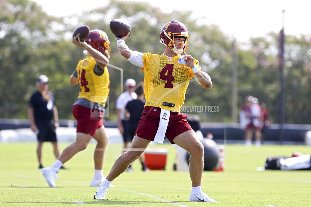 Washington Football Team quarterback Taylor Heinicke (4) throws a pass during NFL football practice in Richmond, Va., Wednesday, July 28, 2021. (AP Photo/Ryan M. Kelly)