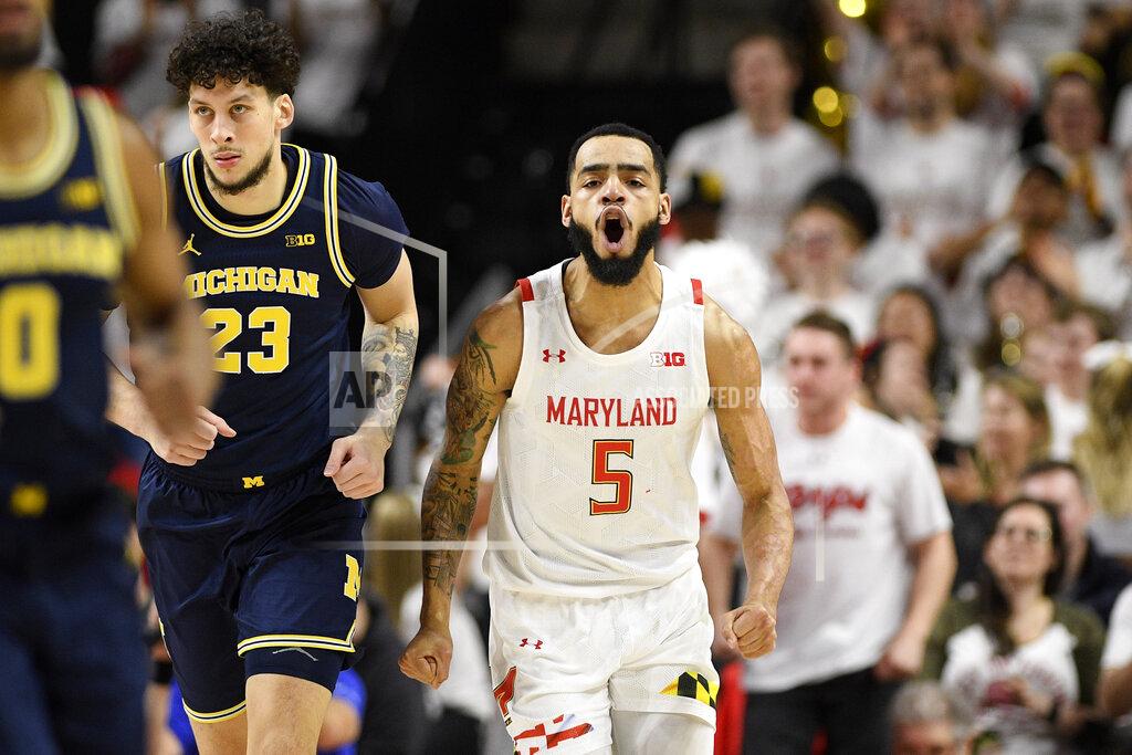 Nick Wass Maryland guard Eric Ayala (5) reacts next to Michigan forward Brandon Johns Jr. (23) during the first half of an NCAA college basketball game, Sunday, March 8, 2020, in College Park, Md. (AP Photo/Nick Wass)