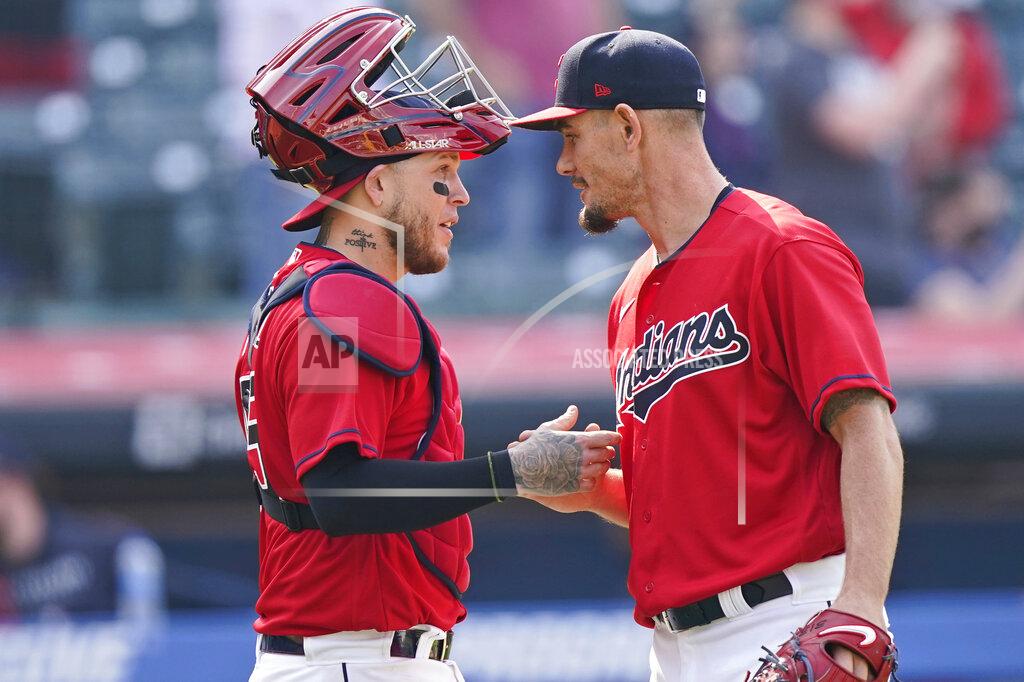 Tony Dejak Cleveland Indians relief pitcher Nick Wittgren, right, is congratulated by catcher Roberto Perez after the Indians defeated the Kansas City Royals 4-2 in a baseball game, Wednesday, April 7, 2021, in Cleveland. (AP Photo/Tony Dejak)